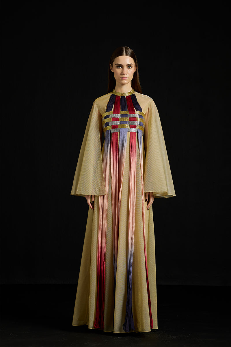 AKHL interwoven gradient tulle kaftan gown, flowing and elegant with layered fabric and vibrant color transitions.