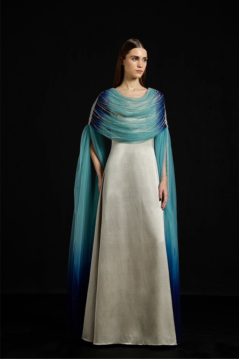 Elegant draped tulle fall-panelled gown by AKHL, showcasing a flowing design with layered tulle fabric and sophisticated style.
