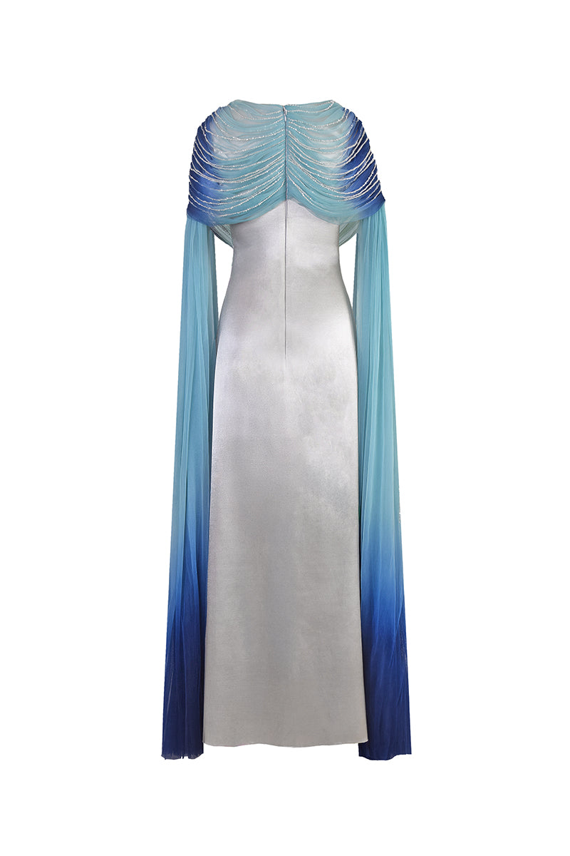 Back view of AKHL draped tulle fall-panelled gown showcasing elegant design and flowing fabric.
