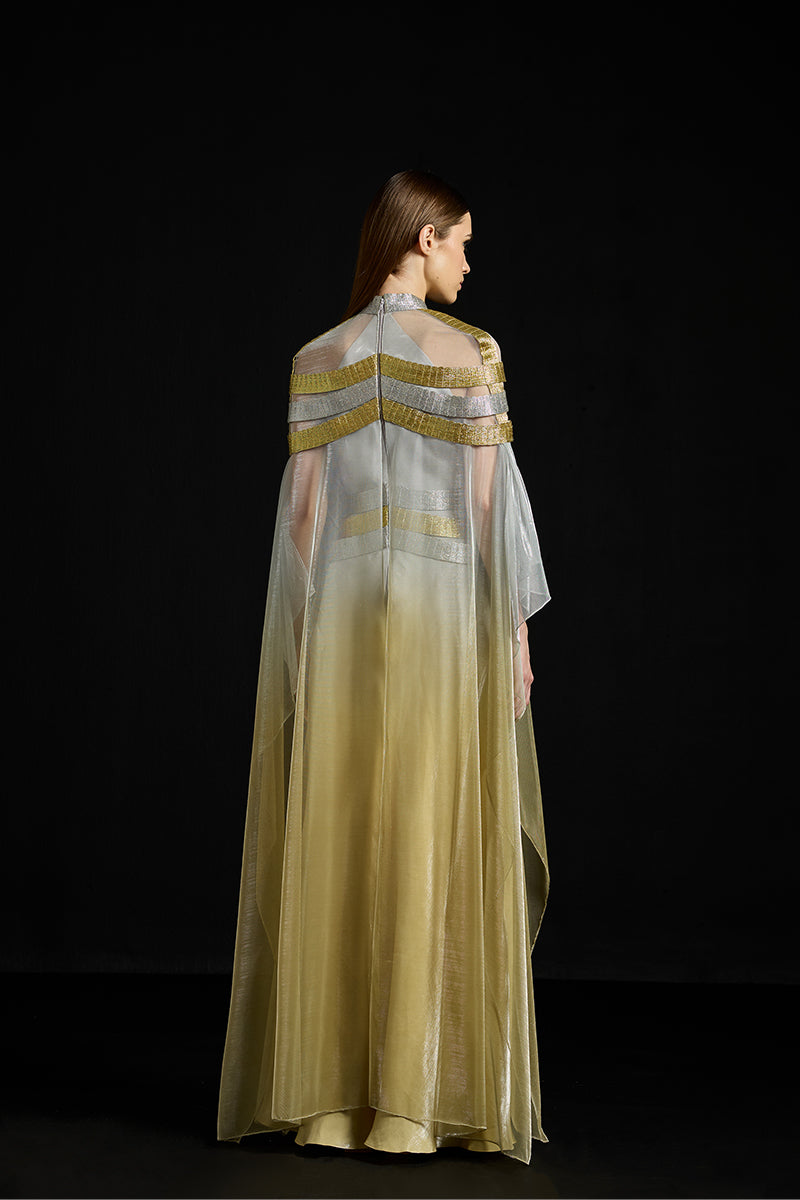 Elegant satin overlay metallic gown by AKHL, featuring a flowing design and shimmering fabric for formal occasions.