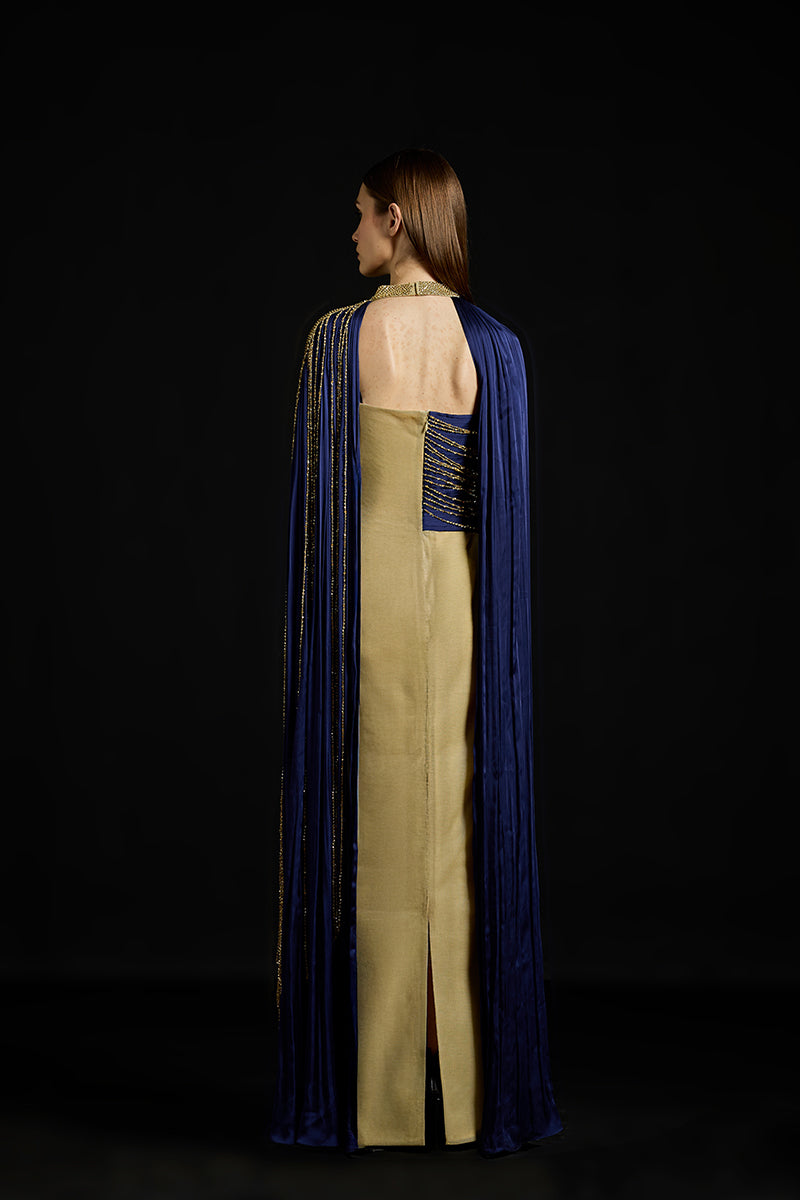 Silver draped sequins metallic gown by AKHL, featuring a flowing silhouette and shimmering fabric for an elegant evening look.