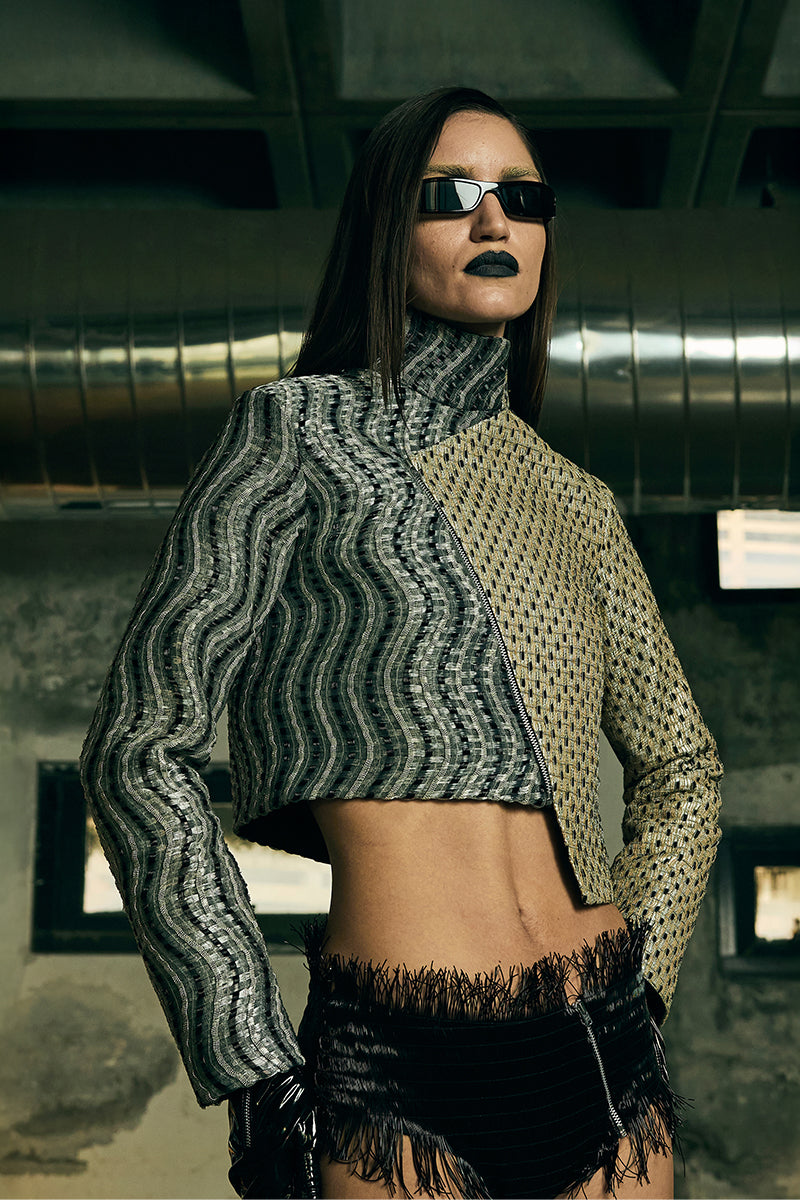 Handwoven asymmetric biker jacket by AKHL featuring distressed leather and unique design details.