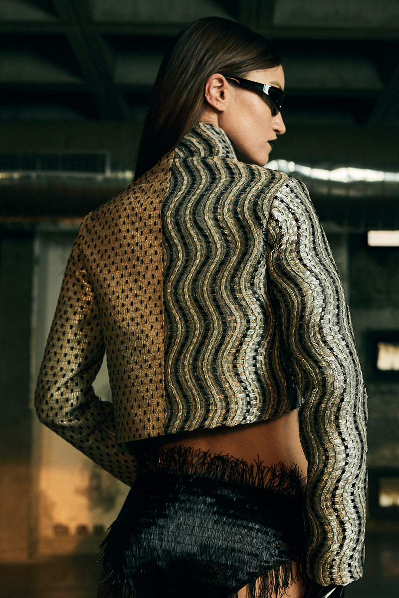 Handwoven asymmetric biker jacket from AKHL featuring unique craftsmanship and stylish design, shown in a close-up image.