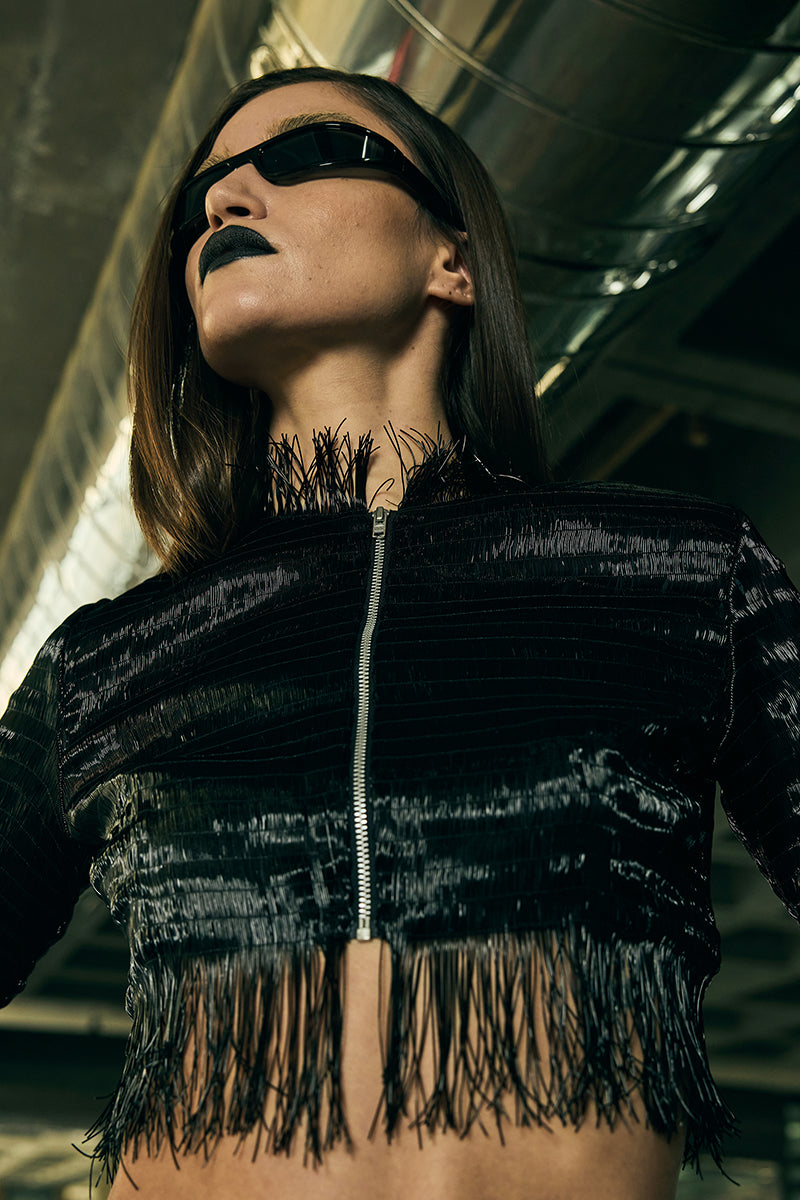 Embossed cropped biker jacket by AKHL featuring detailed embroidery and a stylish, fitted design.
