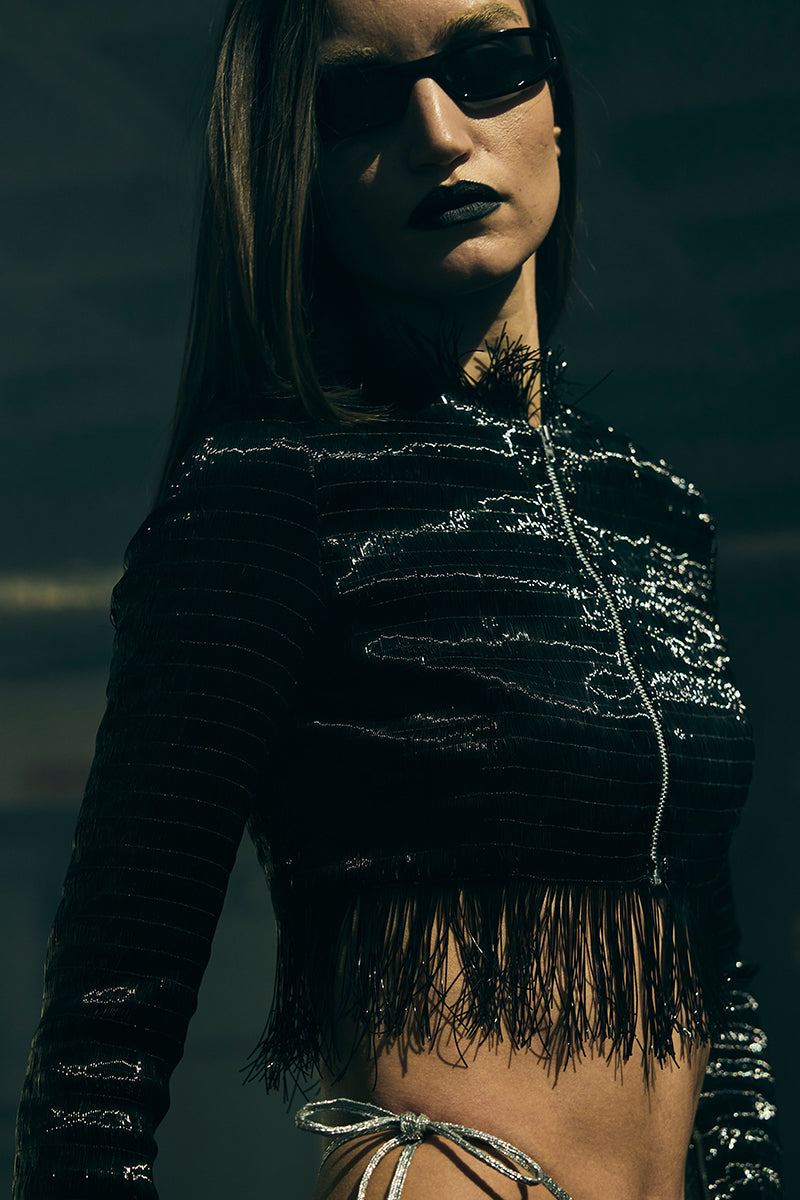 Embossed cropped biker jacket by AKHL featuring intricate embroidery, tailored fit, and stylish design for a modern look.