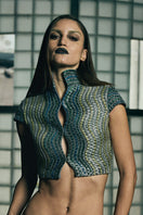Handwoven wave-patterned cropped gilet jacket by AKHL, featuring textured fabric and stylish design.