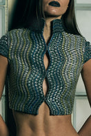 Handwoven wave-patterned cropped gilet by AKHL, showcasing textured fabric and stylish design for layered fashion.