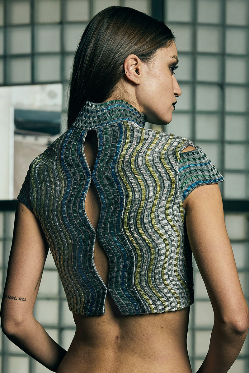 Handwoven wave cropped gilet jacket by AKHL, featuring textured woven fabric and a stylish cropped design.