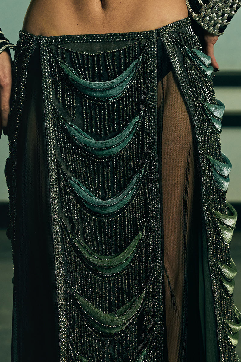 Sheer panelled fringe maxi skirt by AKHL featuring flowing fabric and layered fringe details, perfect for stylish occasions.