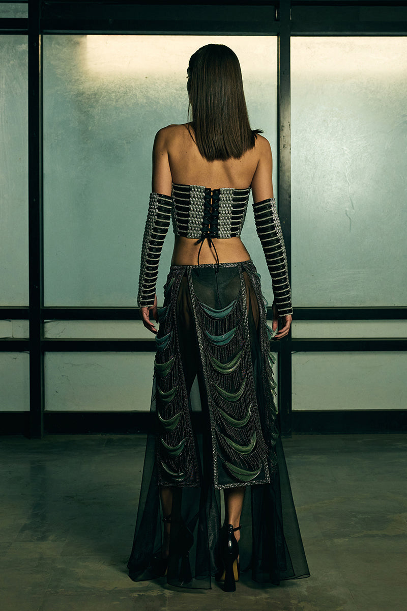 Sheer panelled fringe maxi skirt from AKHL featuring flowing fabric and layered fringe details.