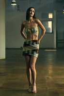 Black INTERWOVEN COLUMN mini skirt by AKHL displayed on a mannequin, showcasing its textured woven fabric and fitted silhouette.