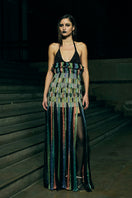 Black AKHL dimensional column maxi skirt with structured design and flowy fabric, styled for elegant wear.