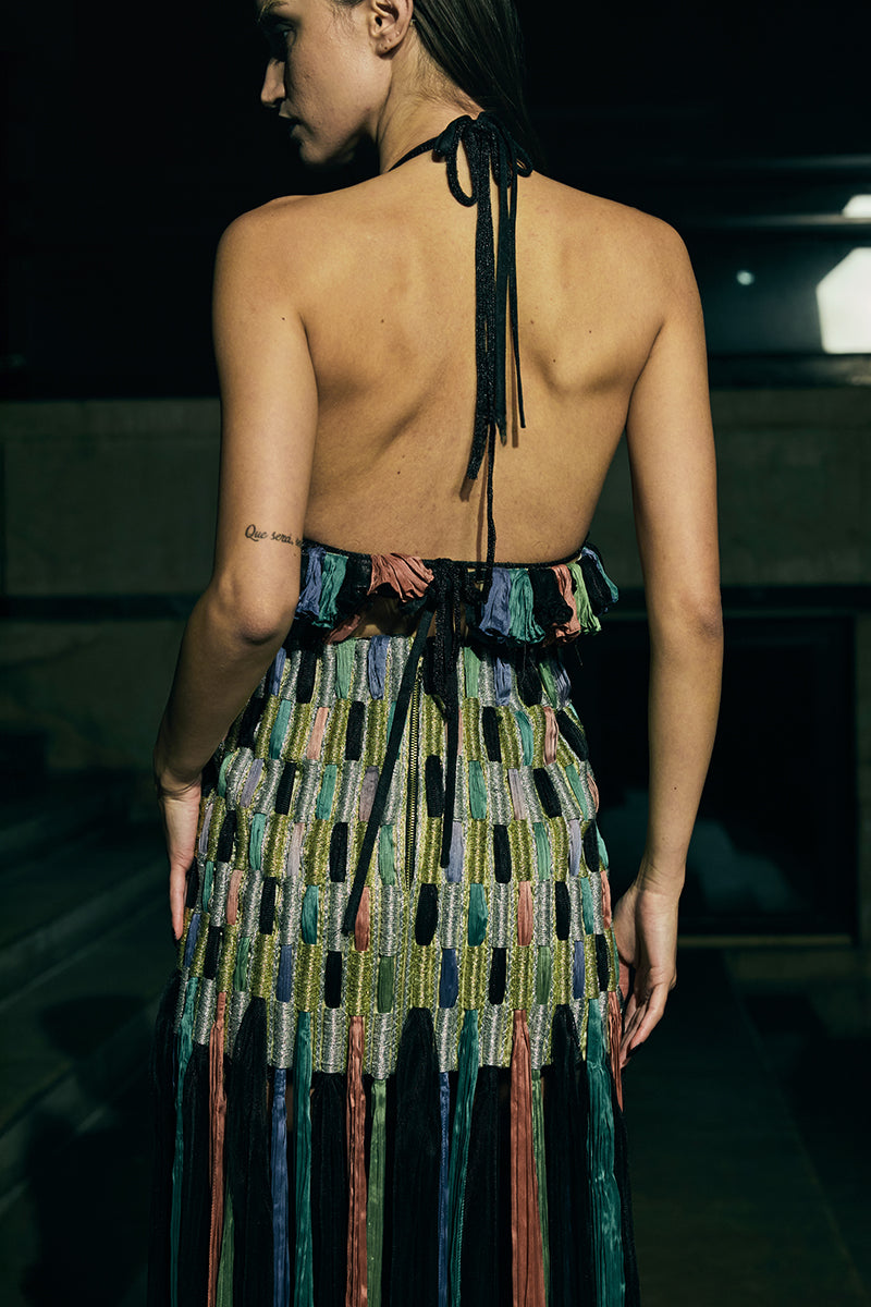 A stylish AKHL maxi skirt with a dimensional column design, featuring a flowing, floor-length silhouette in neutral fabric.