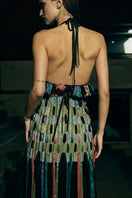 Black AKHL dimensional column maxi skirt with structured design, flowing fabric, and high waist.