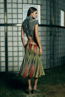 Low-waist panelled midi skirt by AKHL featuring a structured design and sleek silhouette, shown in a neutral fabric.