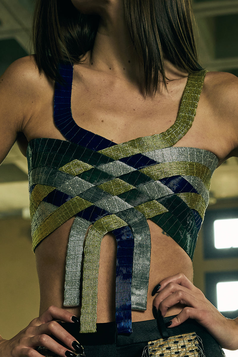 Interwoven sculpted bustier top by AKHL, featuring intricate design and structured fit, displayed on a neutral background.