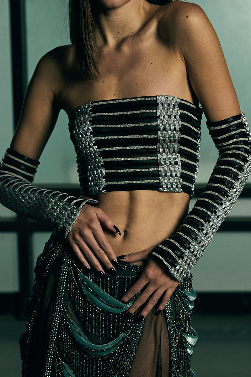 Handwoven sculpted sheer corset top by AKHL featuring intricate weaving and a fitted, elegant design.