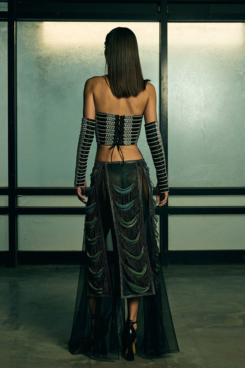 Handwoven sculpted sheer corset top by AKHL featuring intricate detailing and a fitted design, shown on a neutral background.
