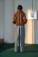 Light blue Alex denim pants by Lorena Saravia, showcasing classic jeans style with a comfortable fit and modern design.