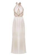 Elegant champagne halter neck evening dress from UNDRESS, featuring a flowing maxi dress design perfect for formal occasions.