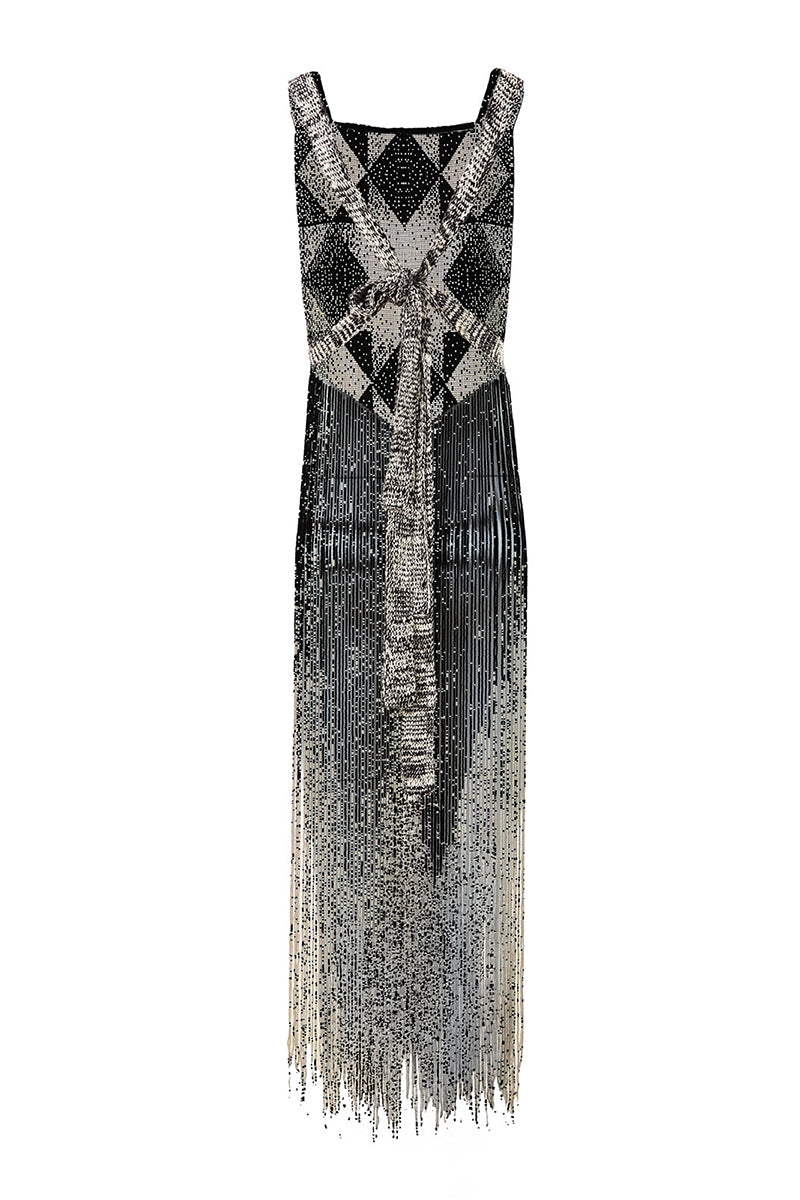 Ivory and black Alma Feral chestpiece top by MAZ Manuela Álvarez, shown in a stylish, fitted design with intricate details.