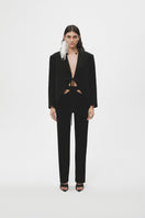 Black JC Pajares maxi blazer with tailored fit, featuring classic lapels and long sleeves, perfect for formal and stylish occasions.