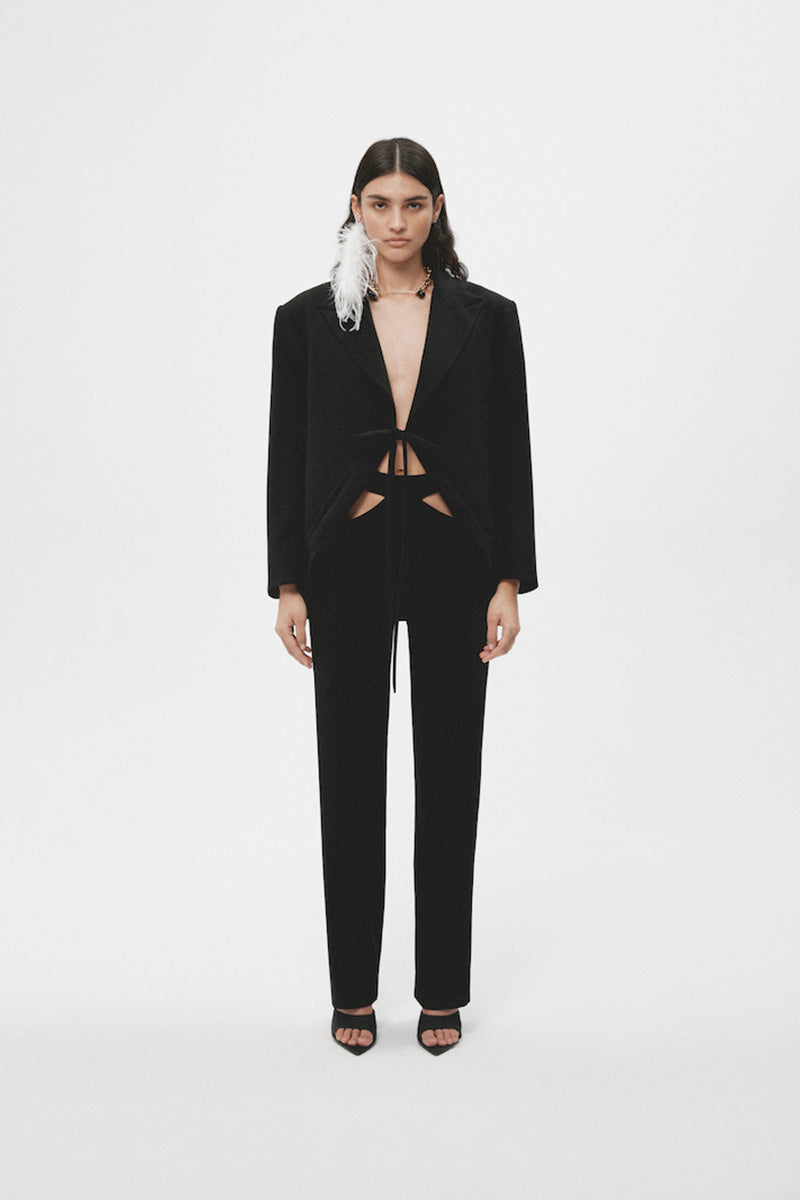 Black JC Pajares maxi blazer with tailored fit, featuring classic lapels and long sleeves, perfect for formal and stylish occasions.