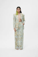 Multicolor tie-dye oversized sequin blazer by JC Pajares, featuring vibrant patterns and shiny embellishments.