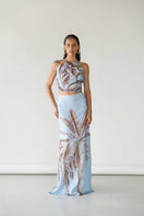 Tinta Latina Amal maxi skirt in soft blue fabric, flowing design with a high waist and elegant style.