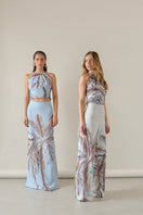 Soft blue Amal maxi skirt by Tinta Latina, flowing fabric with a high waist and elegant design, perfect for casual or dressy occasions.