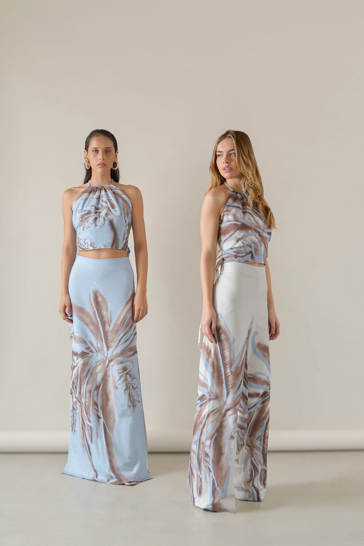 Soft blue Amal maxi skirt by Tinta Latina, flowing fabric with a high waist and elegant design, perfect for casual or dressy occasions.