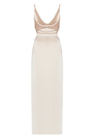 Beige satin backless maxi dress by UNDRESS, flowing fabric with elegant design, perfect for formal occasions.