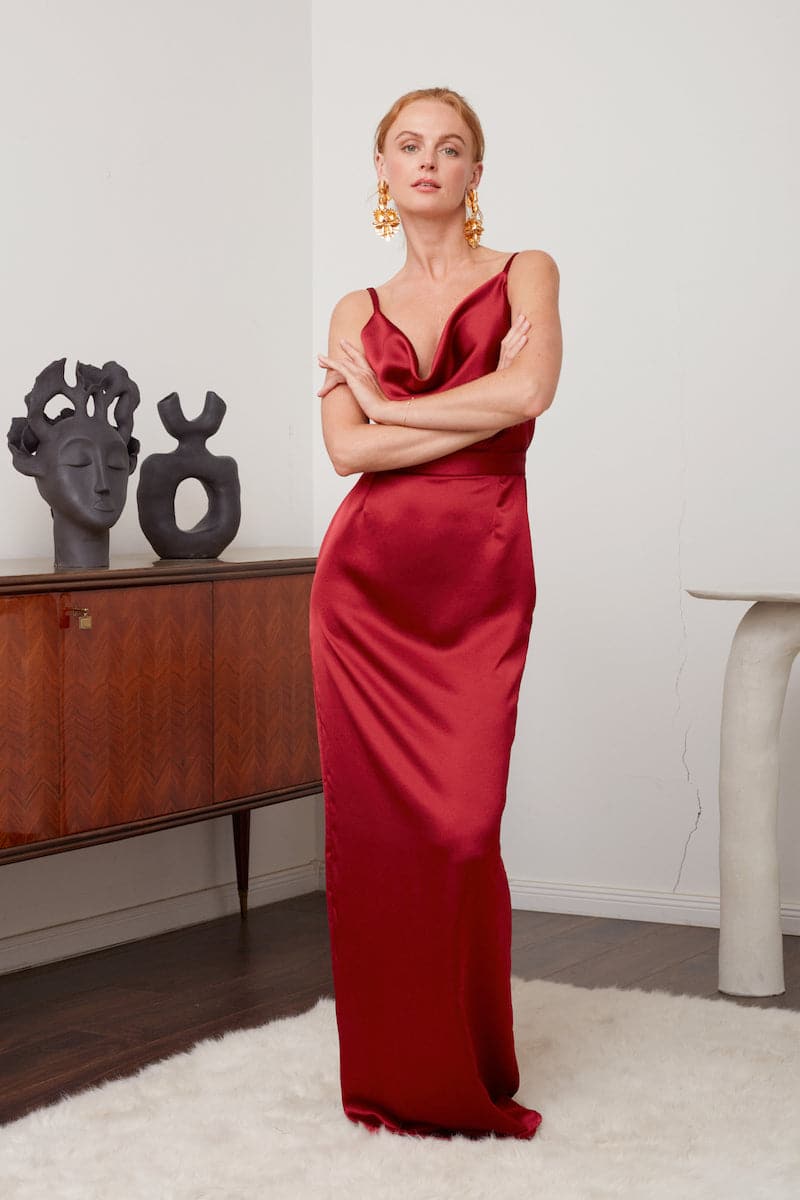 Deep red backless maxi dress by UNDRESS, flowing fabric, elegant design perfect for evening wear.