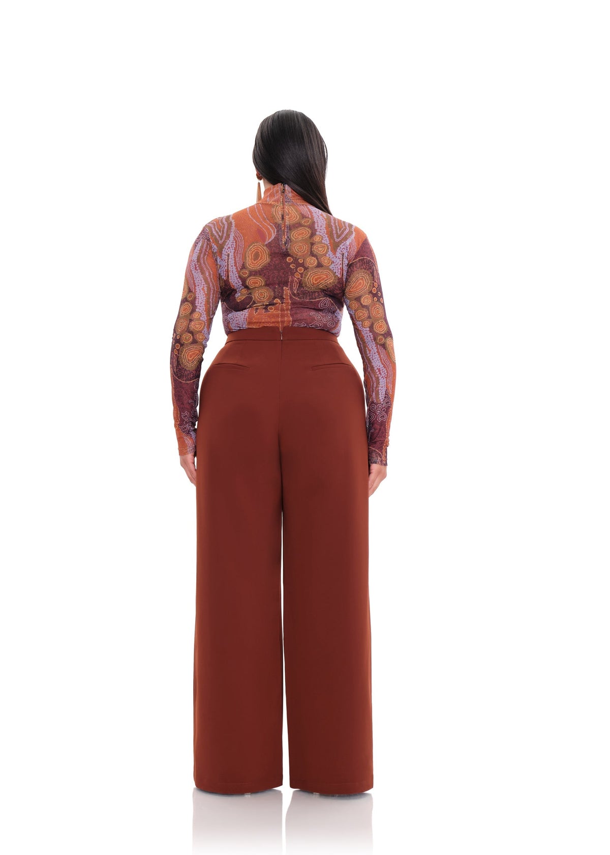 Plus size cinnamon Atta bootcut pants by Andrea Iyamah displayed on a mannequin, showcasing their stylish fit and fabric.