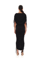 Black Ratu Mesh Maxi Dress by Andrea Iyamah displayed on a mannequin, showing the back view with sheer mesh fabric and elegant design.