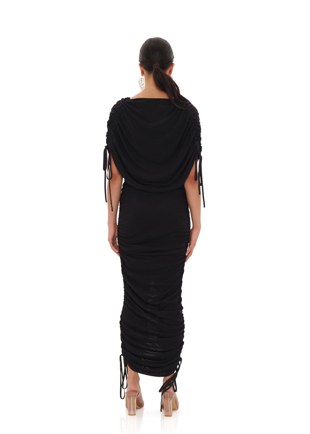 Black Ratu Mesh Maxi Dress by Andrea Iyamah displayed on a mannequin, showing the back view with sheer mesh fabric and elegant design.