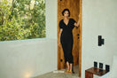 Black Ratu mesh maxi dress by Andrea Iyamah, shown on a model with intricate mesh design and flowing silhouette.