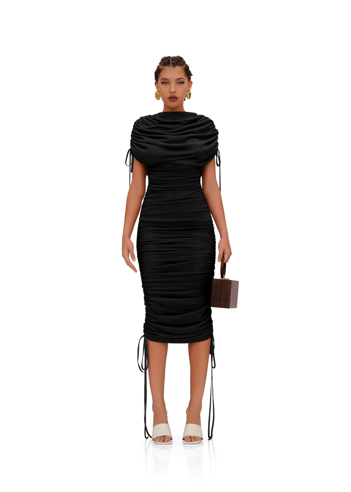 Black Ratu mesh maxi dress by Andrea Iyamah, shown on a model, featuring a flowing silhouette and intricate mesh details.
