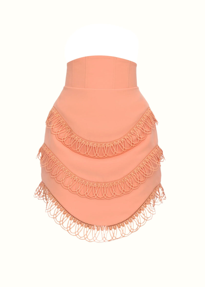 Andrea Iyamah RIZO Peach Corset Mini Skirt featuring a fitted waist and stylish design, shown from the front.