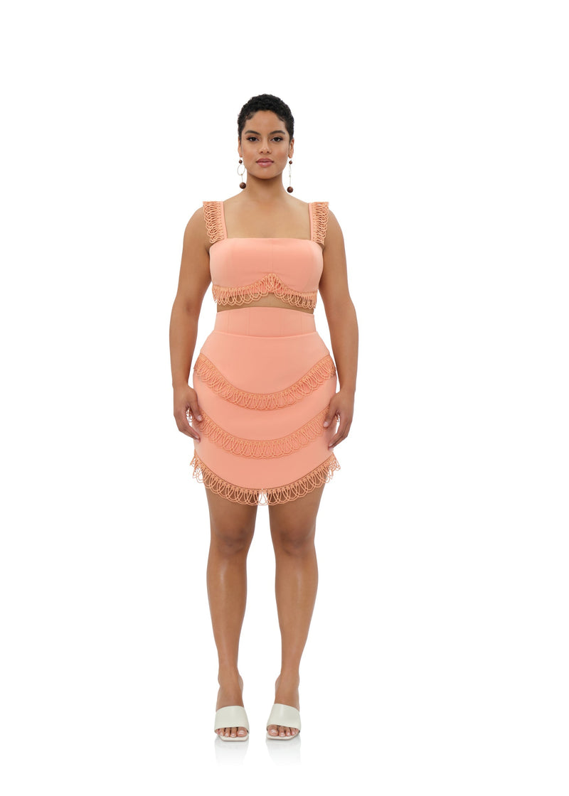 Pink peach Rizo powder mini skirt by Andrea Iyamah with a fitted waist and stylish silhouette.