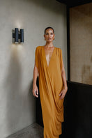 Andrea Iyamah ADI knit kaftan dress, a stylish maxi dress with intricate knit details, flowing fabric, and elegant design.