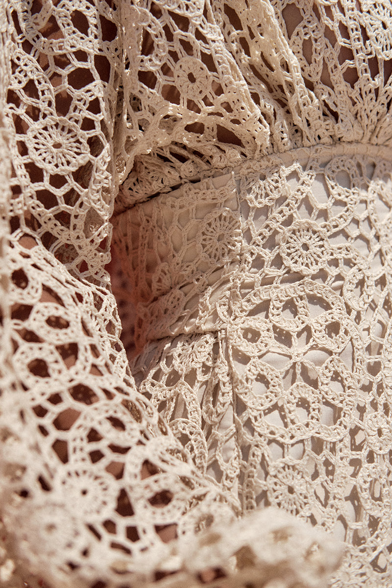 Ivory Dani Mini Lace Dress by Andrea Iyamah, featuring delicate lace details and a fitted silhouette, showcased on a model.