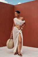 Ivory crochet cover-up dress by Andrea Iyamah, featuring intricate crochet patterns and a relaxed fit for beach or poolside wear.