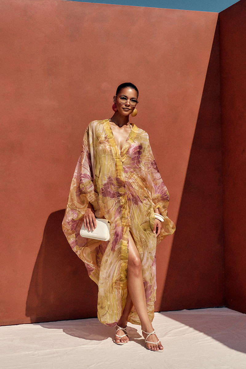Andrea Iyamah Labu Organza Robe in Vibra Print featuring sheer fabric and vibrant pattern, displayed on a model.