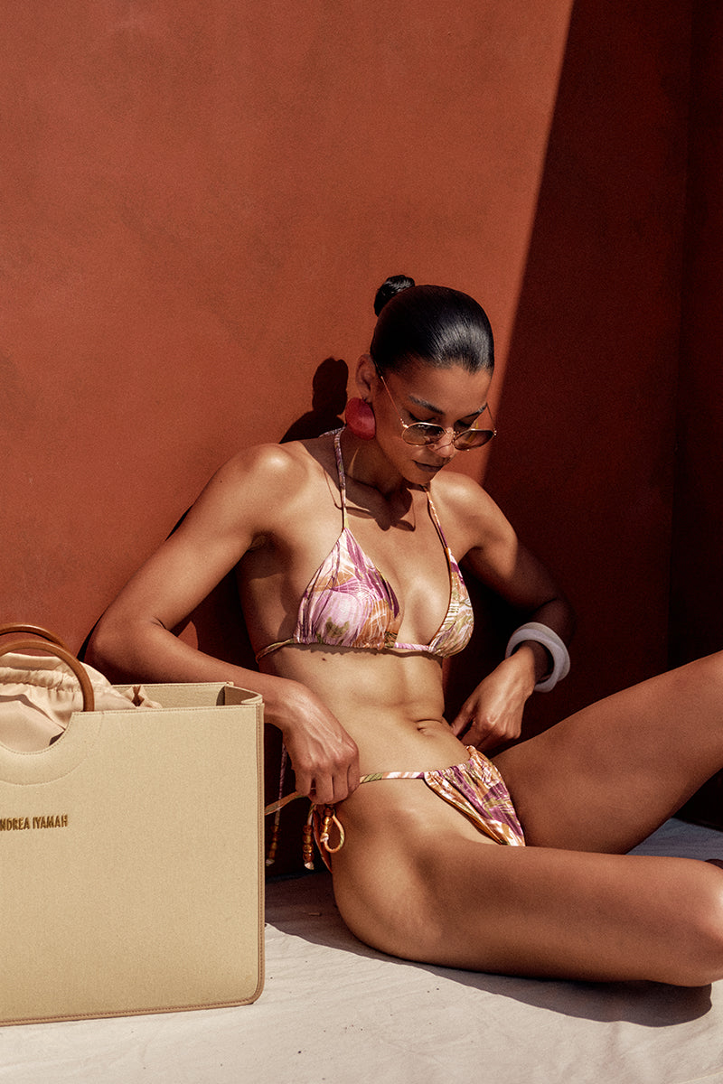 Reversible bikini top in vibrant VibrA print with bright gold accents by Andrea Iyamah, featuring a stylish tropical design.