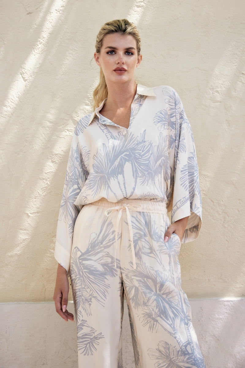 White Ankara blouse from Tinta Latina featuring vibrant print, stylish tops design, perfect for casual or dressy occasions.