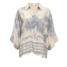 White Ankara blouse by Tinta Latina featuring vibrant printed fabric and stylish design, perfect for casual or dressy occasions.