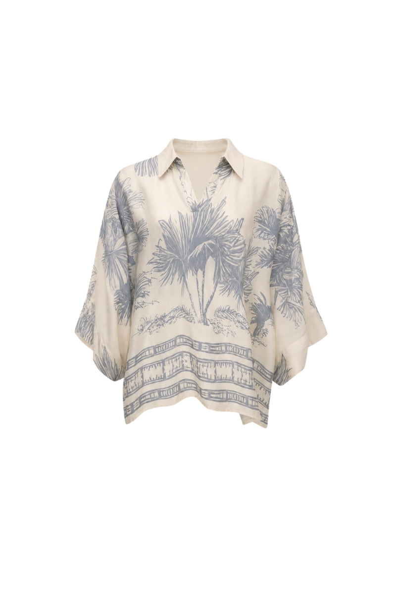 White Ankara blouse by Tinta Latina featuring vibrant printed fabric and stylish design, perfect for casual or dressy occasions.