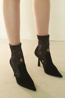 Black suede ANNA BOOT 95 by House of Atana with a sleek, pointed toe and stiletto heel, showcasing elegant women's boots.