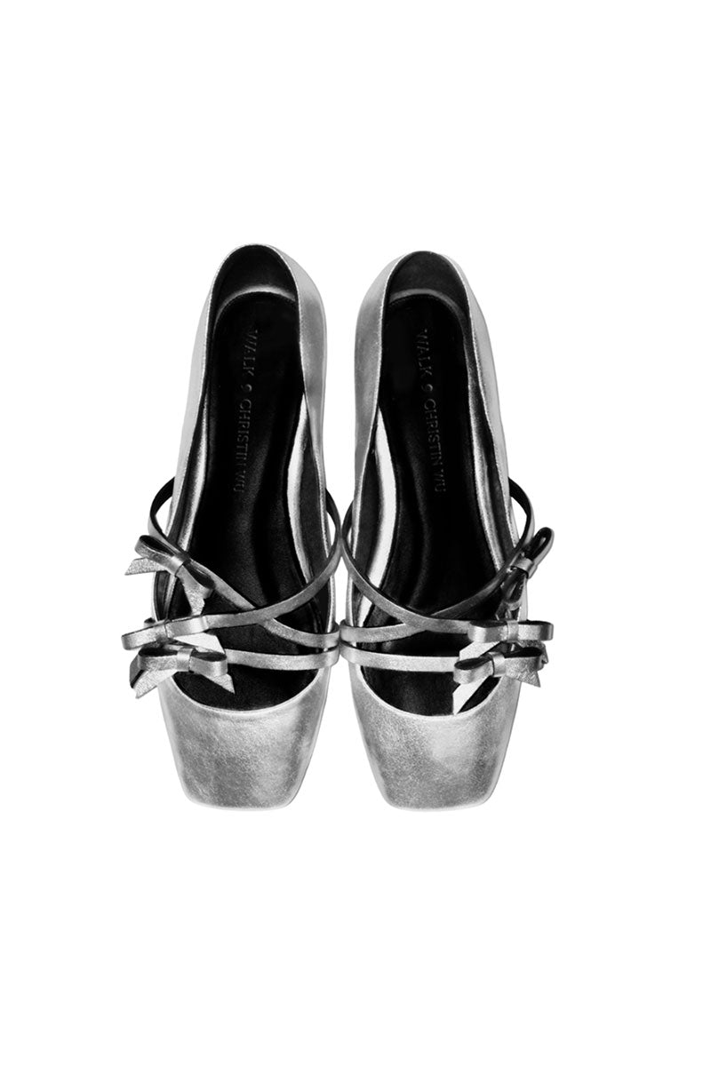 Silver Christin Wu Annaya flats with pointed toes and sleek design, perfect for stylish, comfortable everyday wear.